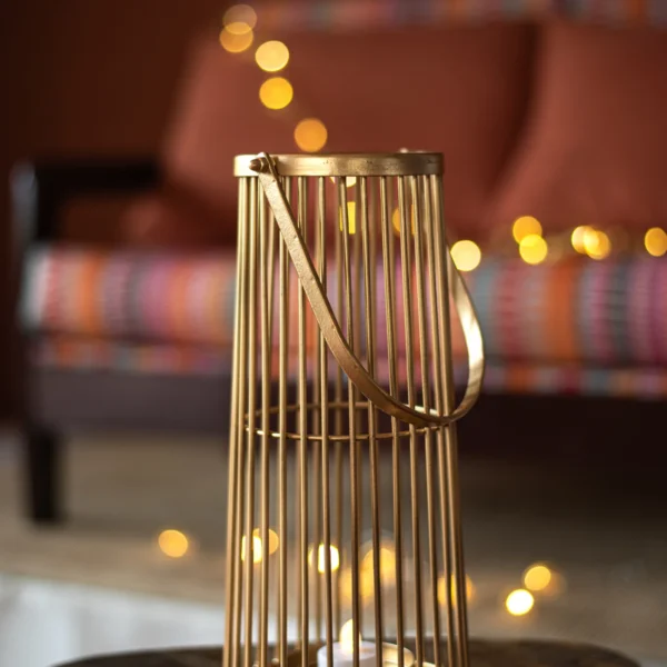 Handcrafted dull gold powder coated metal candle holder with handle