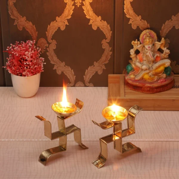 Golden Standing Satiya Diya | Brass Swastik Tealight Holder